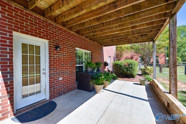 view of patio featuring fence