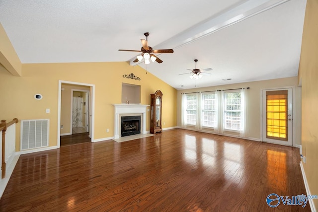 unfurnished living room with visible vents, vaulted ceiling with beams, baseboards, and ceiling fan
