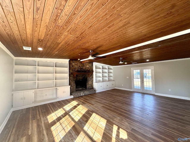 unfurnished living room featuring french doors, a stone fireplace, wooden ceiling, and wood finished floors