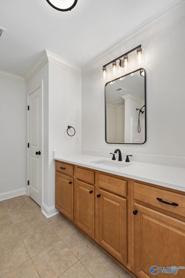 bathroom featuring tile patterned floors, visible vents, vanity, and crown molding