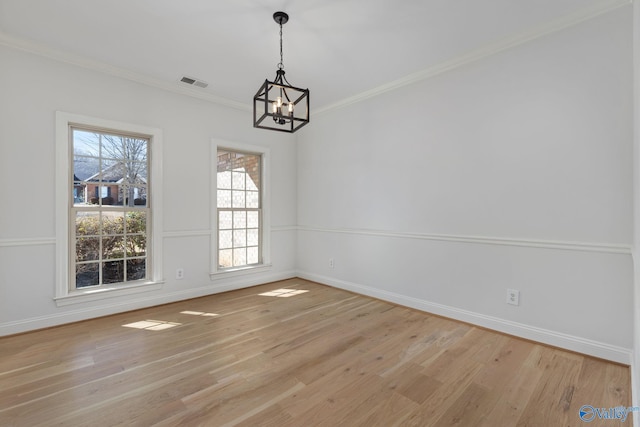 unfurnished dining area with visible vents, baseboards, light wood-style floors, and ornamental molding