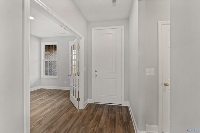 entryway with dark wood-type flooring