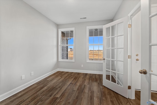 spare room featuring dark hardwood / wood-style floors