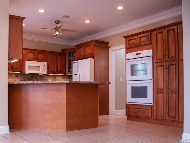 kitchen featuring kitchen peninsula, decorative backsplash, white appliances, and ornamental molding