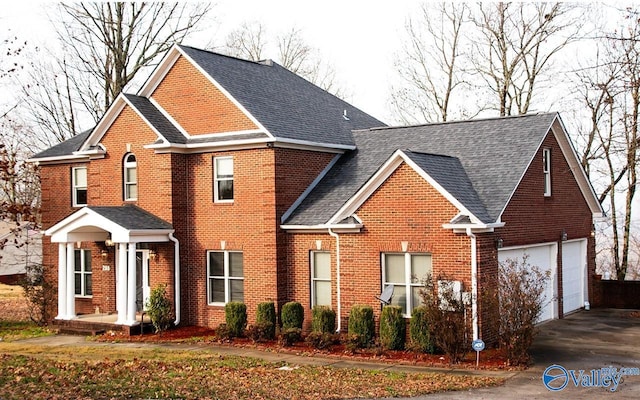 view of front of property with a garage