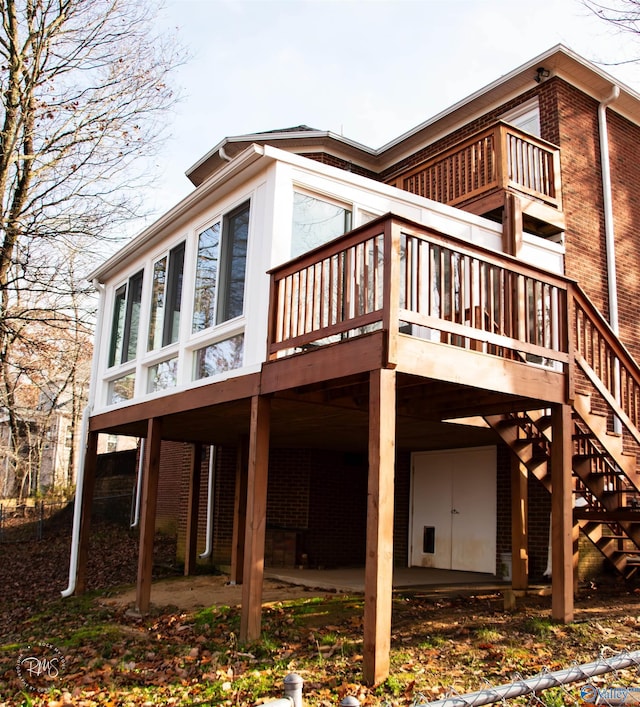 view of side of property with a wooden deck