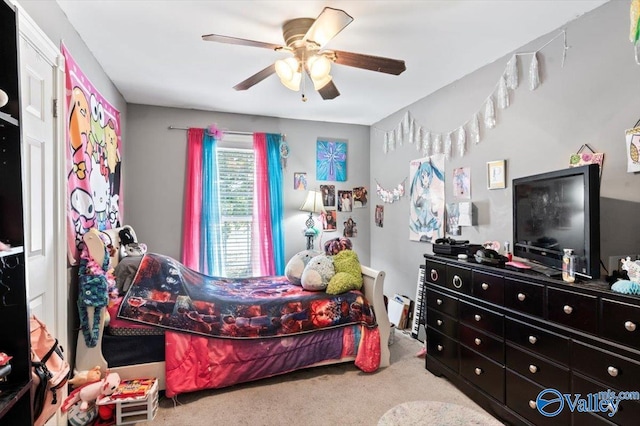 bedroom with ceiling fan and light carpet