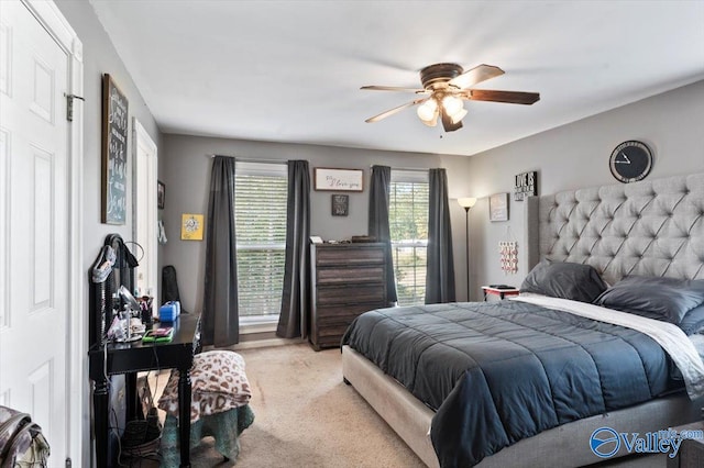 bedroom with light carpet and ceiling fan