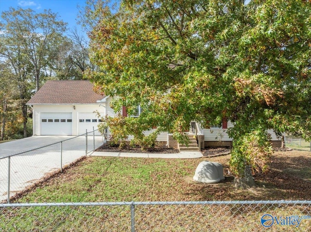 obstructed view of property with a garage