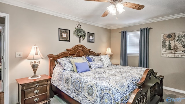 carpeted bedroom with ceiling fan, baseboards, and crown molding