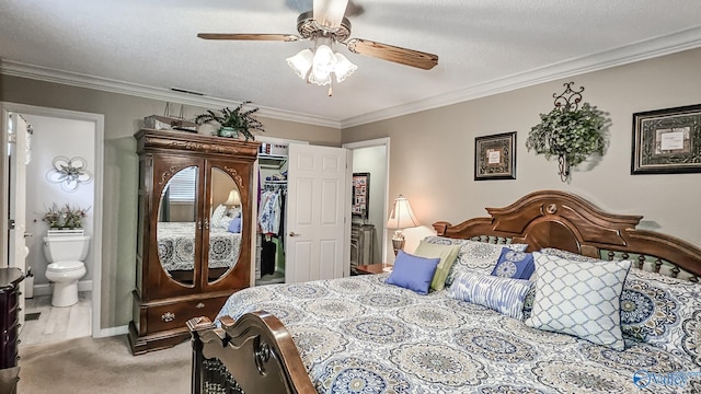 bedroom with a textured ceiling, ensuite bath, light colored carpet, and crown molding