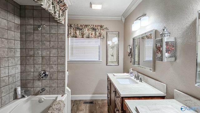 full bath with baseboards, wood finished floors, bathtub / shower combination, crown molding, and vanity