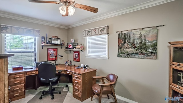 home office featuring a ceiling fan, light carpet, crown molding, and baseboards