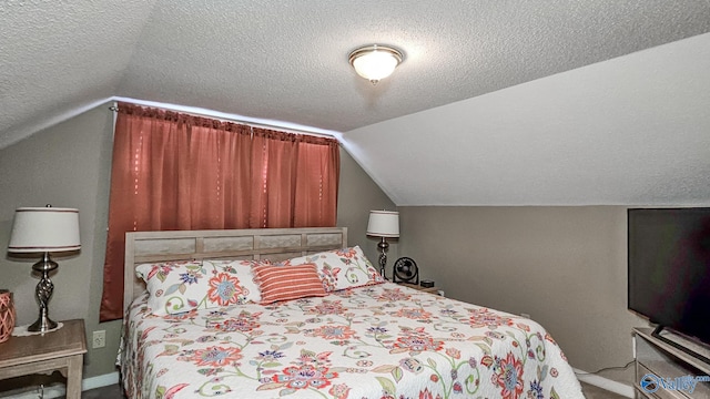 bedroom featuring lofted ceiling, carpet flooring, and a textured ceiling