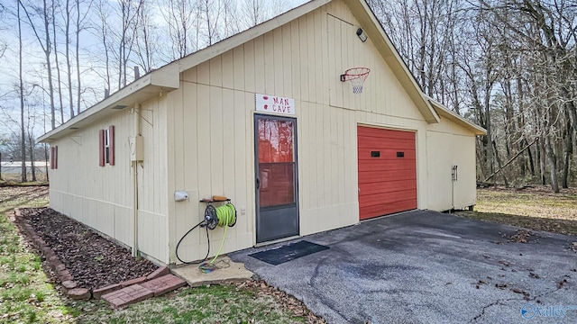 view of outbuilding with an outbuilding and driveway