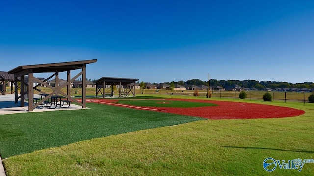 surrounding community with a gazebo and a yard
