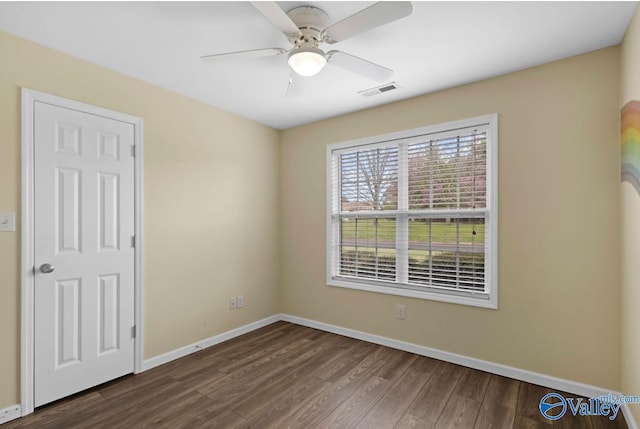 26560 Mill Creek Dr, Athens, AL 35613 - unfurnished room with a ceiling fan, dark wood-type flooring, baseboards, and visible vents