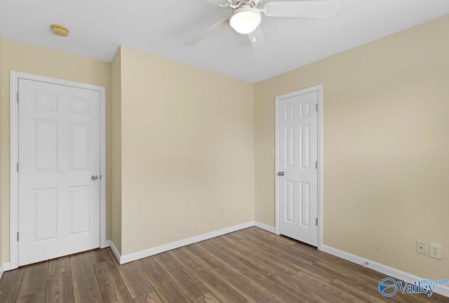 26560 Mill Creek Dr, Athens, AL 35613 - unfurnished bedroom with baseboards, wood finished floors, and a ceiling fan
