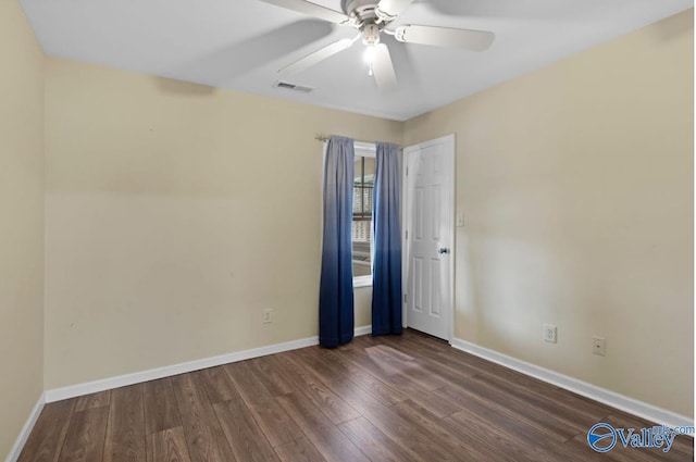 26560 Mill Creek Dr, Athens, AL 35613 - spare room with baseboards, dark wood-style floors, visible vents, and ceiling fan