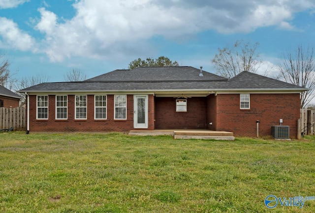 26560 Mill Creek Dr, Athens, AL 35613 - rear view of house featuring brick siding, fence, cooling unit, and a yard