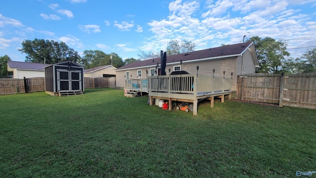 view of yard featuring a storage unit and a wooden deck