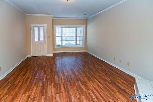 interior space featuring crown molding, baseboards, a wealth of natural light, and wood finished floors