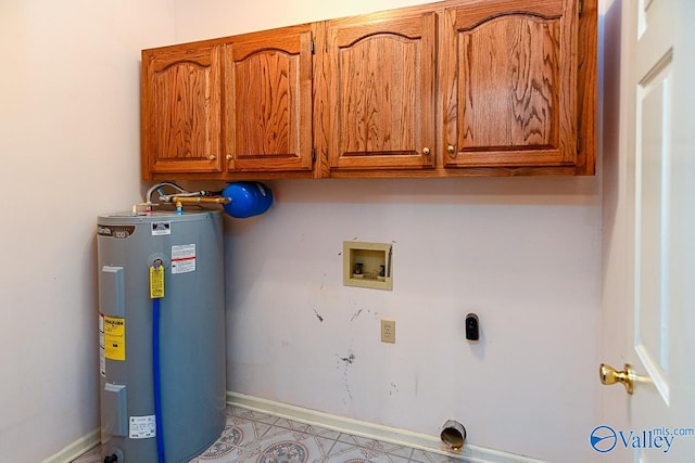 washroom with washer hookup, cabinet space, electric water heater, hookup for an electric dryer, and baseboards