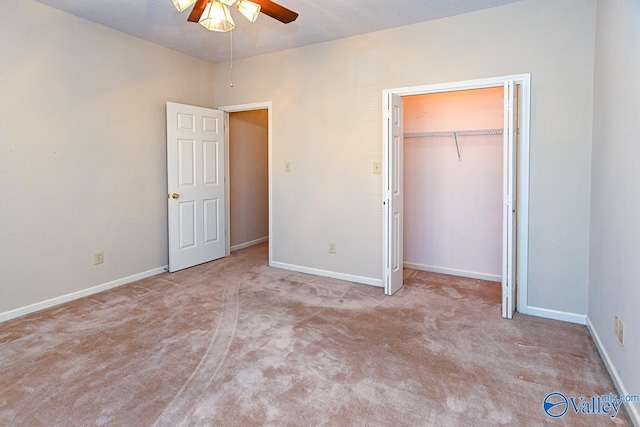 unfurnished bedroom with a closet, carpet flooring, and baseboards