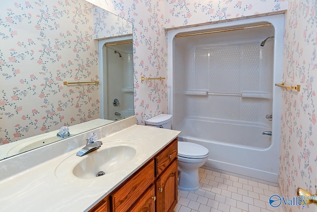 bathroom with tile patterned floors, vanity, toilet, and wallpapered walls