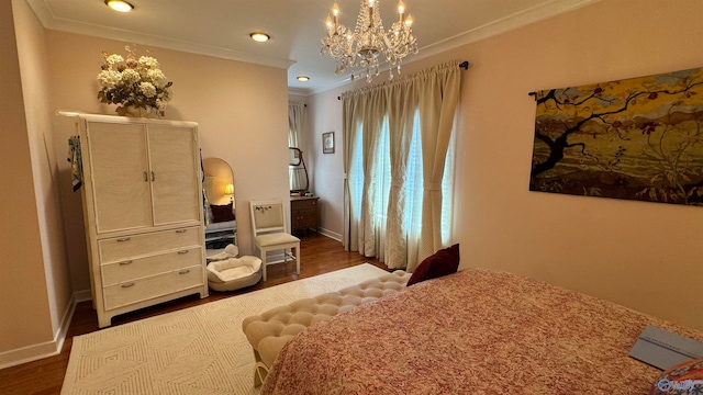 bedroom featuring dark hardwood / wood-style flooring, crown molding, and a chandelier