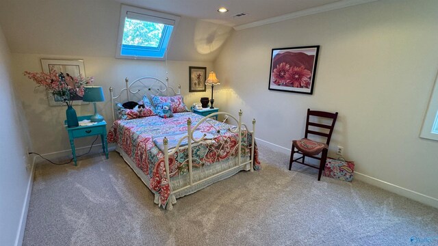 carpeted bedroom with vaulted ceiling and ornamental molding