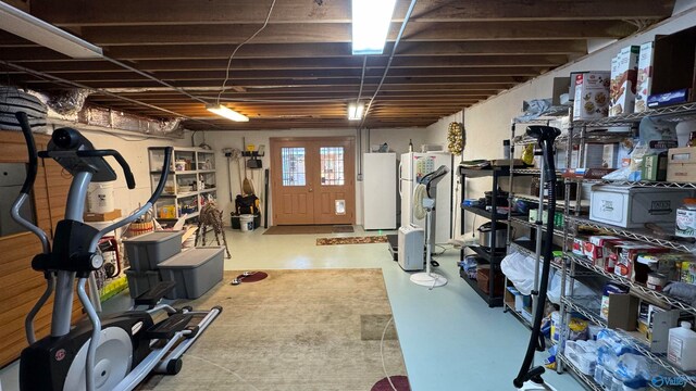 basement featuring white refrigerator