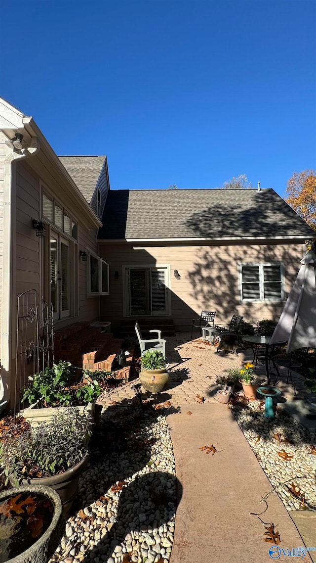 back of property featuring a patio