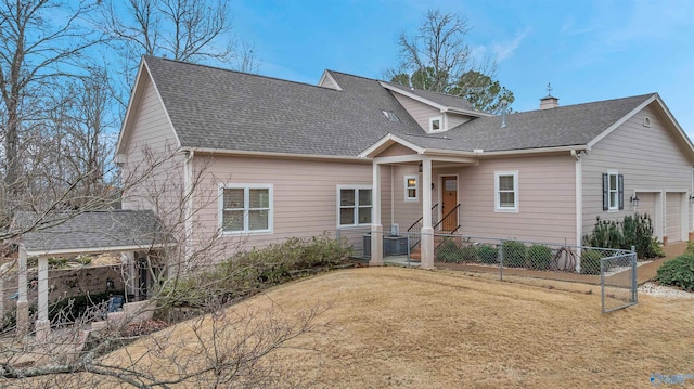 view of front of property featuring central AC unit and a front lawn