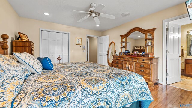 bedroom featuring ceiling fan, hardwood / wood-style flooring, access to outside, and a textured ceiling