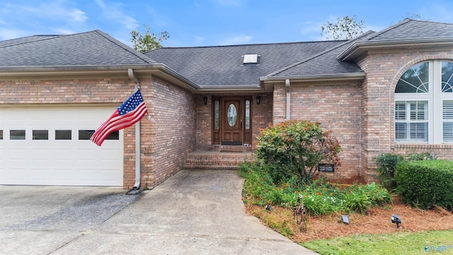 doorway to property featuring a garage