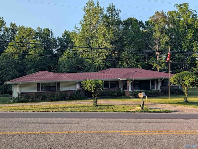1350 W US Highway 278 W, Cullman, AL 35057 - ranch-style house featuring brick siding, driveway, metal roof, and a front lawn