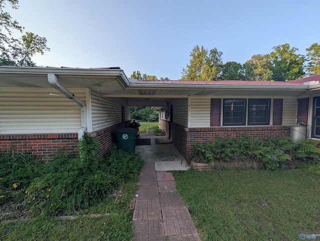 1350 W US Highway 278 W, Cullman, AL 35057 - view of front of property with brick siding and a carport
