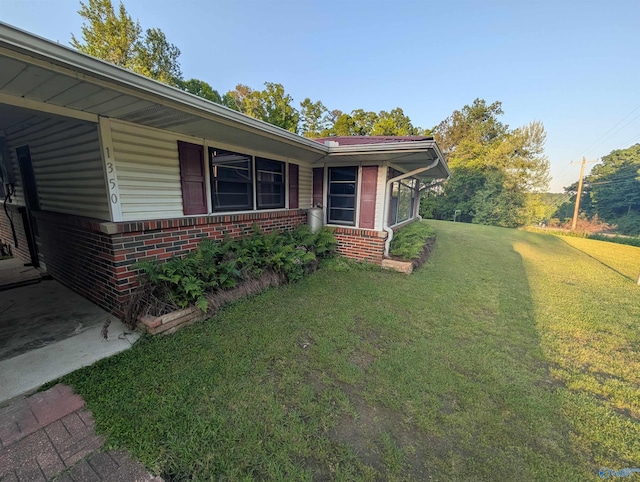 1350 W US Highway 278 W, Cullman, AL 35057 - view of home's exterior with a lawn and brick siding