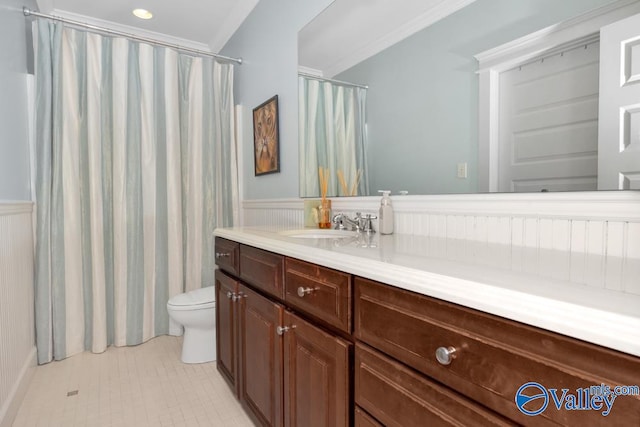 bathroom featuring tile patterned flooring, crown molding, walk in shower, toilet, and vanity