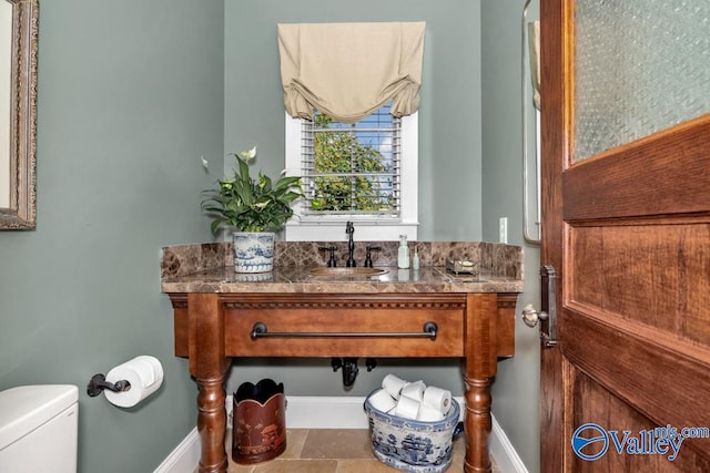 bathroom with vanity and toilet