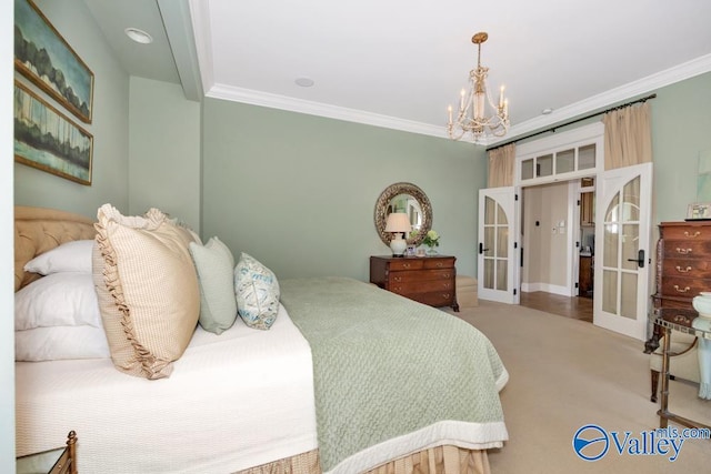 carpeted bedroom featuring ornamental molding, a notable chandelier, and french doors