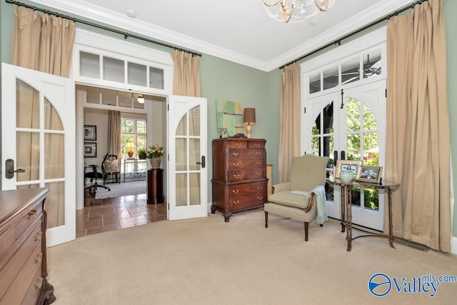 living area featuring plenty of natural light, ornamental molding, and french doors