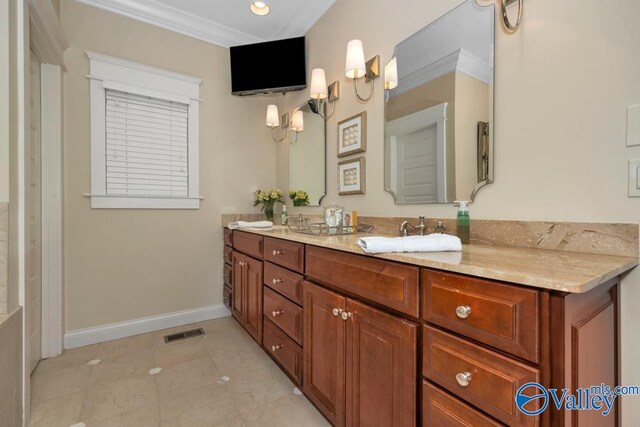 bathroom featuring vanity, ornamental molding, and tile patterned floors