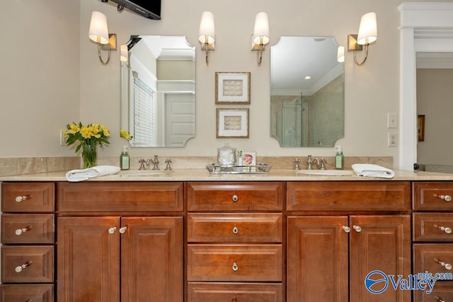 bathroom with a shower with shower door, ornamental molding, and vanity