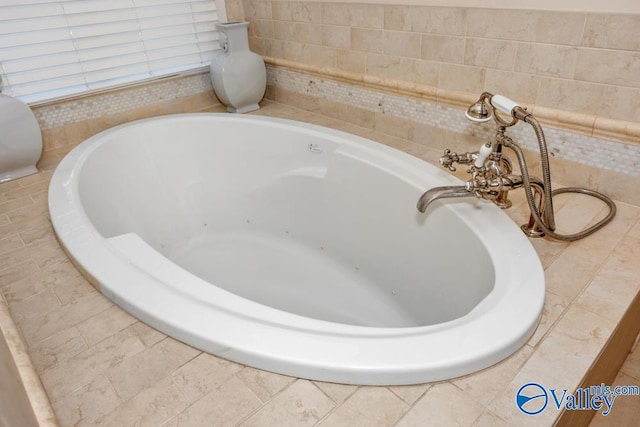 interior space with tiled tub