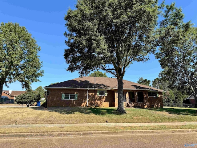 ranch-style house with a front lawn