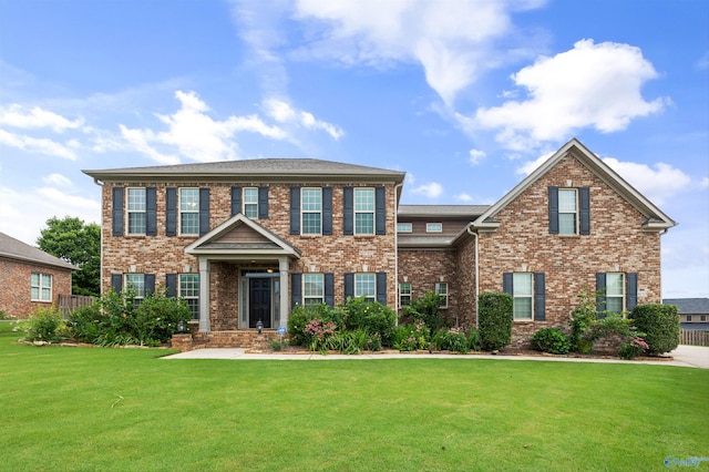 4513 Stone Park Cir, Owens Cross Roads, AL 35763 - colonial inspired home with a front yard and brick siding