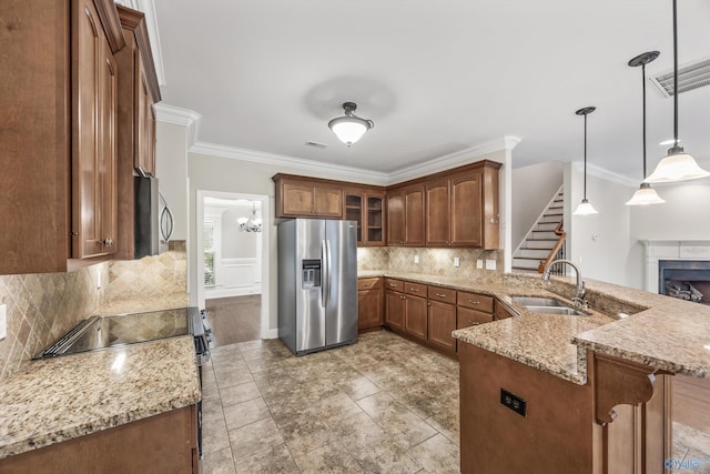 4513 Stone Park Cir, Owens Cross Roads, AL 35763 - kitchen featuring appliances with stainless steel finishes, a peninsula, crown molding, light stone counters, and glass insert cabinets
