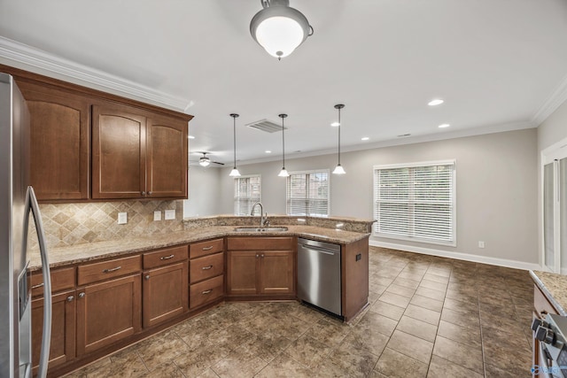 4513 Stone Park Cir, Owens Cross Roads, AL 35763 - kitchen featuring appliances with stainless steel finishes, a peninsula, backsplash, pendant lighting, and light stone counters